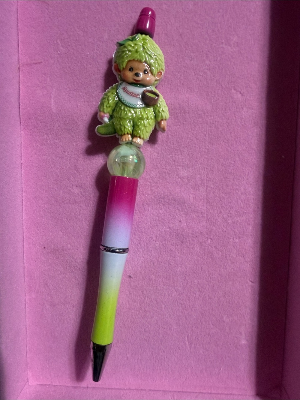Pink and green Monchichi pen.